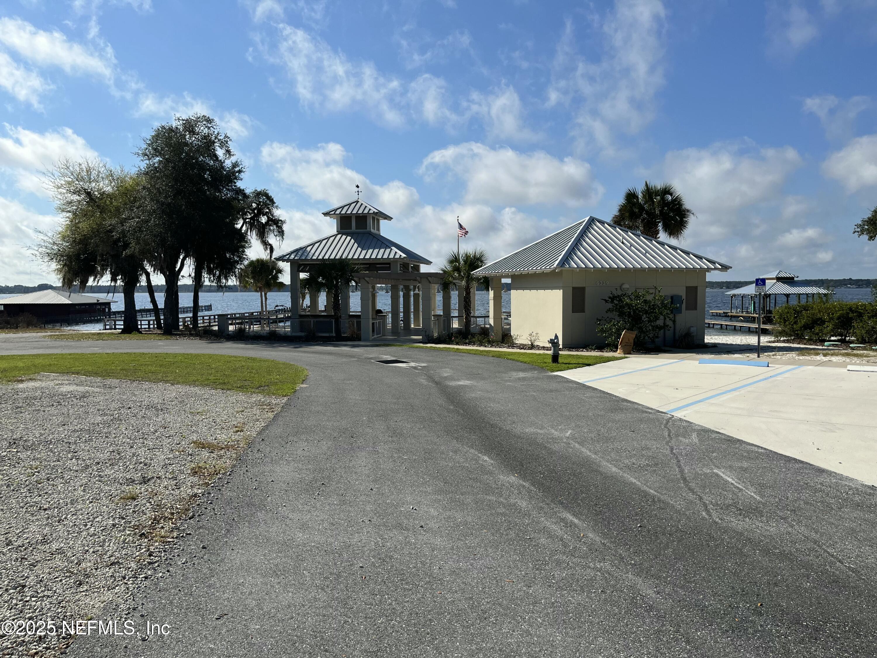 6486 Cabana Trace Starke, FL 32091 - Photo 8 of 16 a front view of a house with a garden and yard