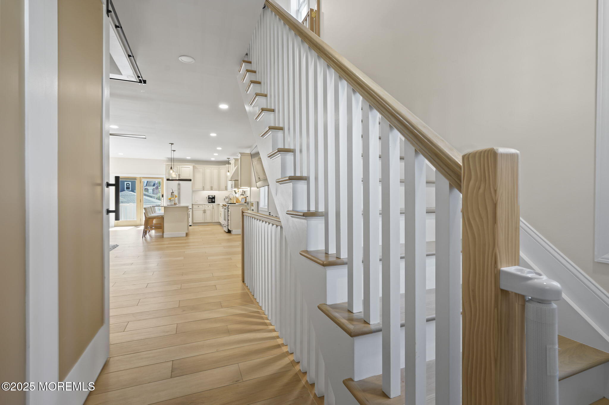 128 1st Street Keyport, NJ 07735 - Photo 14 of 38 a view of a hallway with wooden floor and staircase