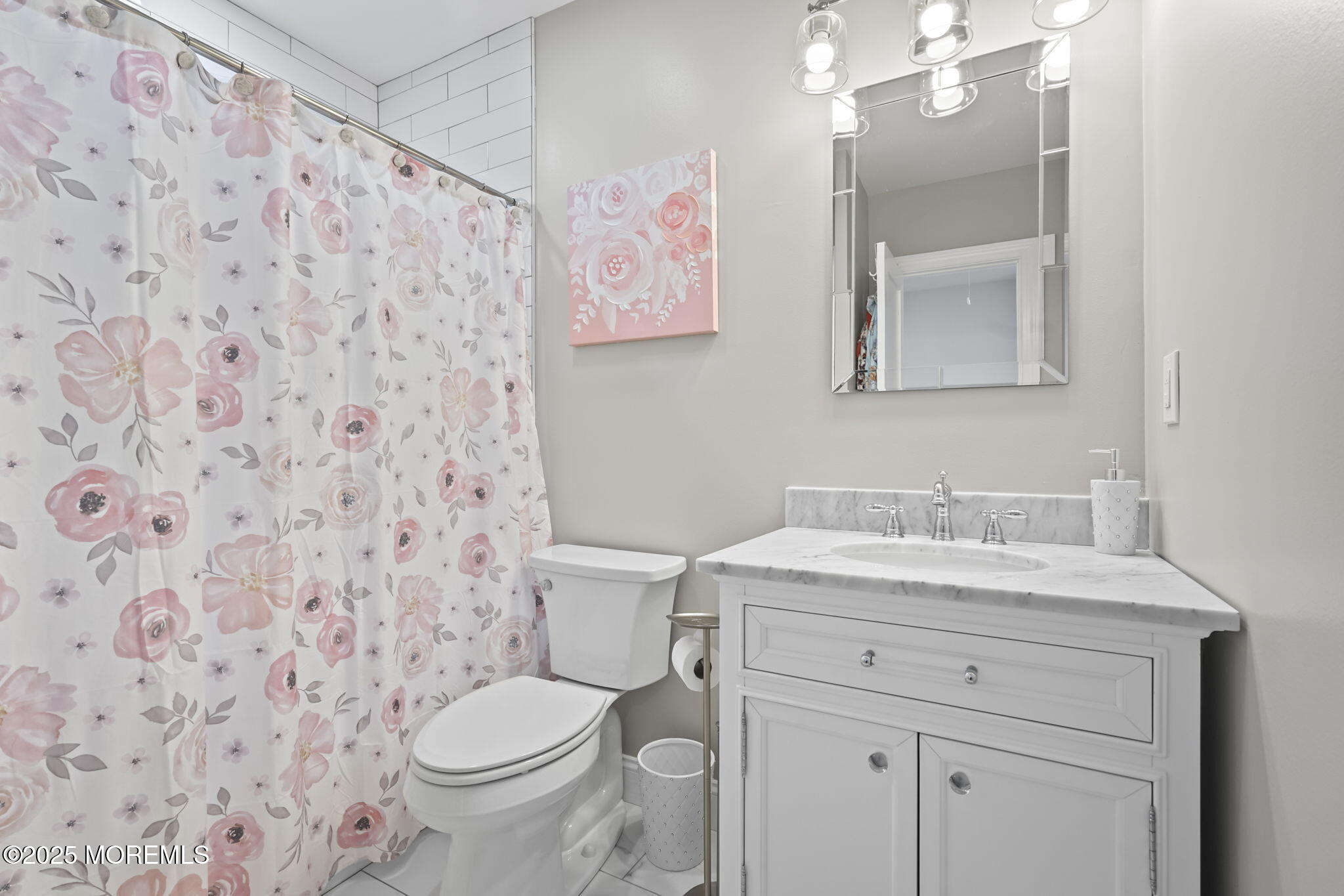 128 1st Street Keyport, NJ 07735 - Photo 19 of 38 a bathroom with a granite countertop toilet sink and mirror
