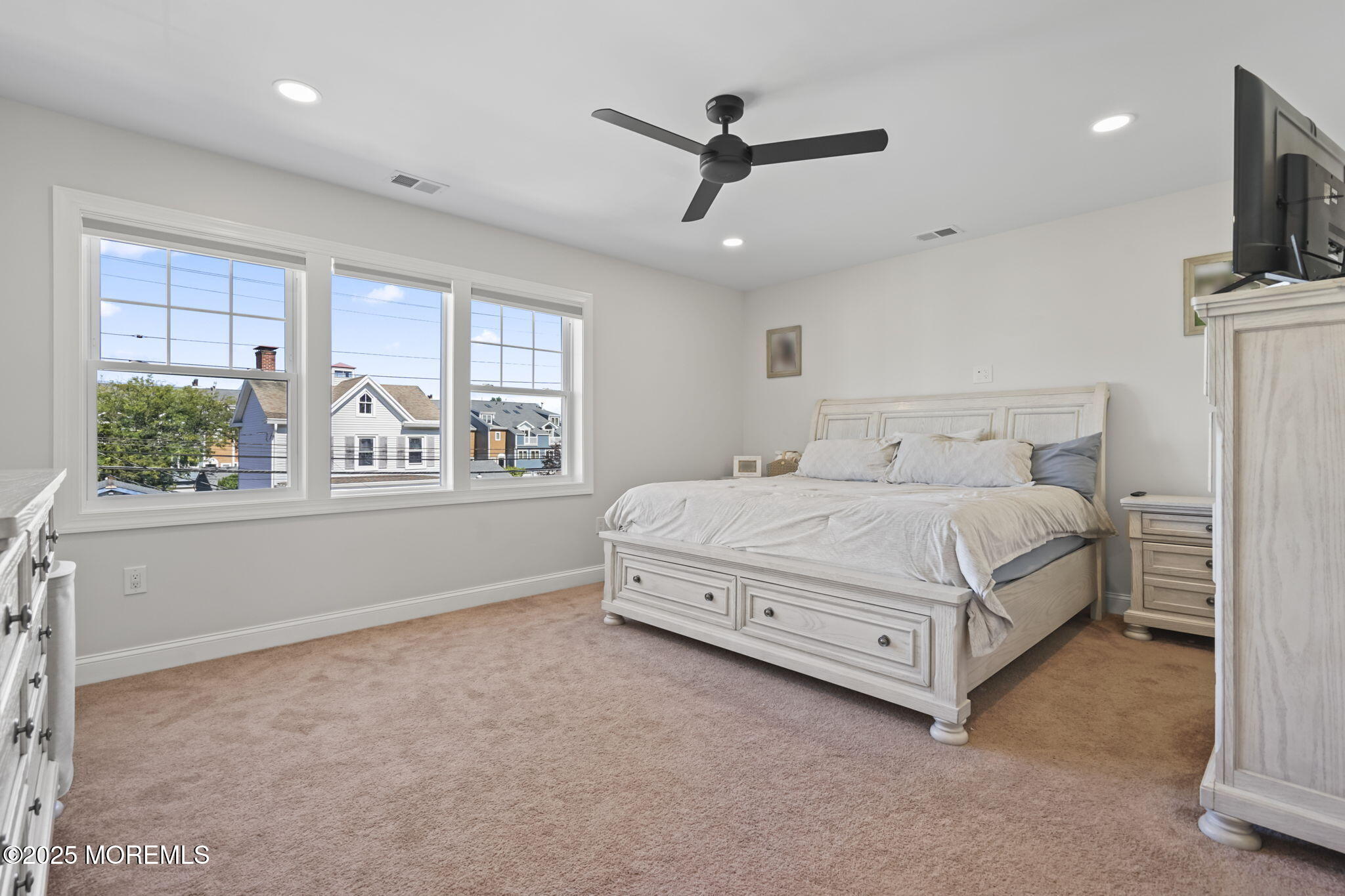 128 1st Street Keyport, NJ 07735 - Photo 20 of 38 a bedroom with a bed a window and flat screen tv