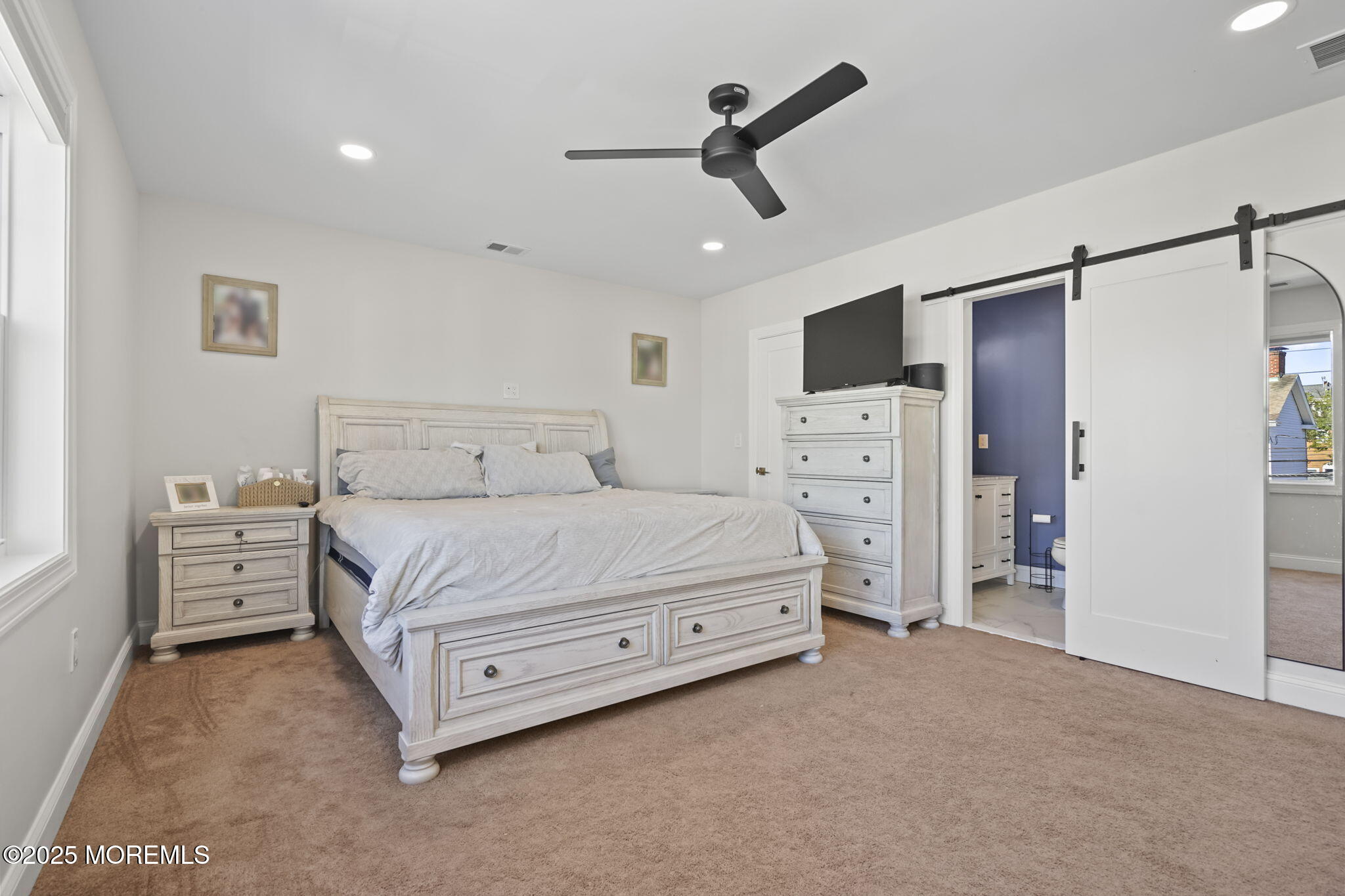 128 1st Street Keyport, NJ 07735 - Photo 21 of 38 a bedroom with a bed closet and flat tv screen