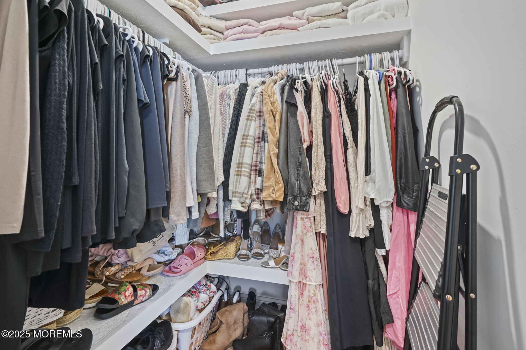 128 1st Street Keyport, NJ 07735 - Photo 24 of 38 a view of walk in closet with clothes