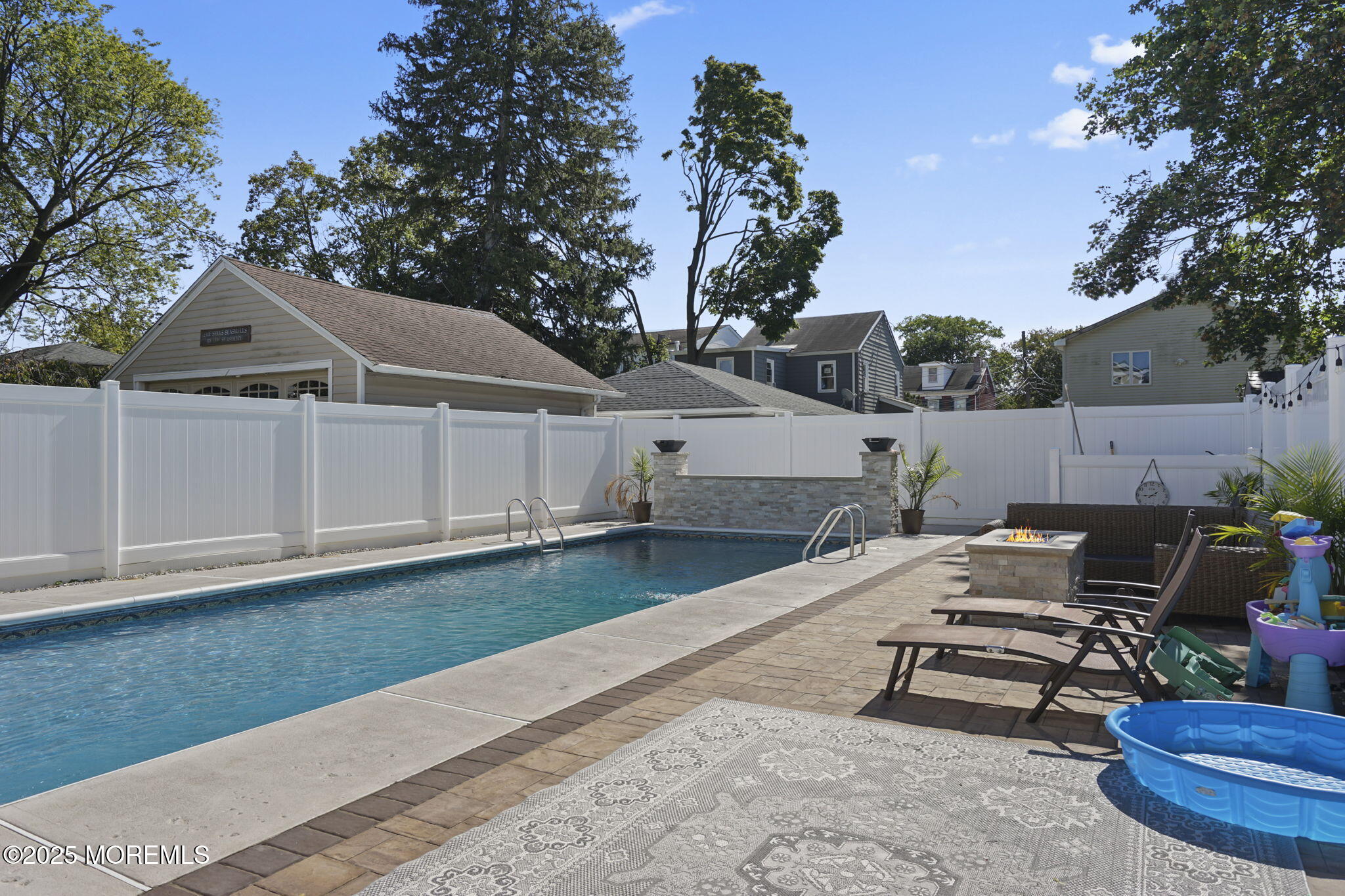 128 1st Street Keyport, NJ 07735 - Photo 35 of 38 a view of a patio with table and chairs with wooden fence and plants
