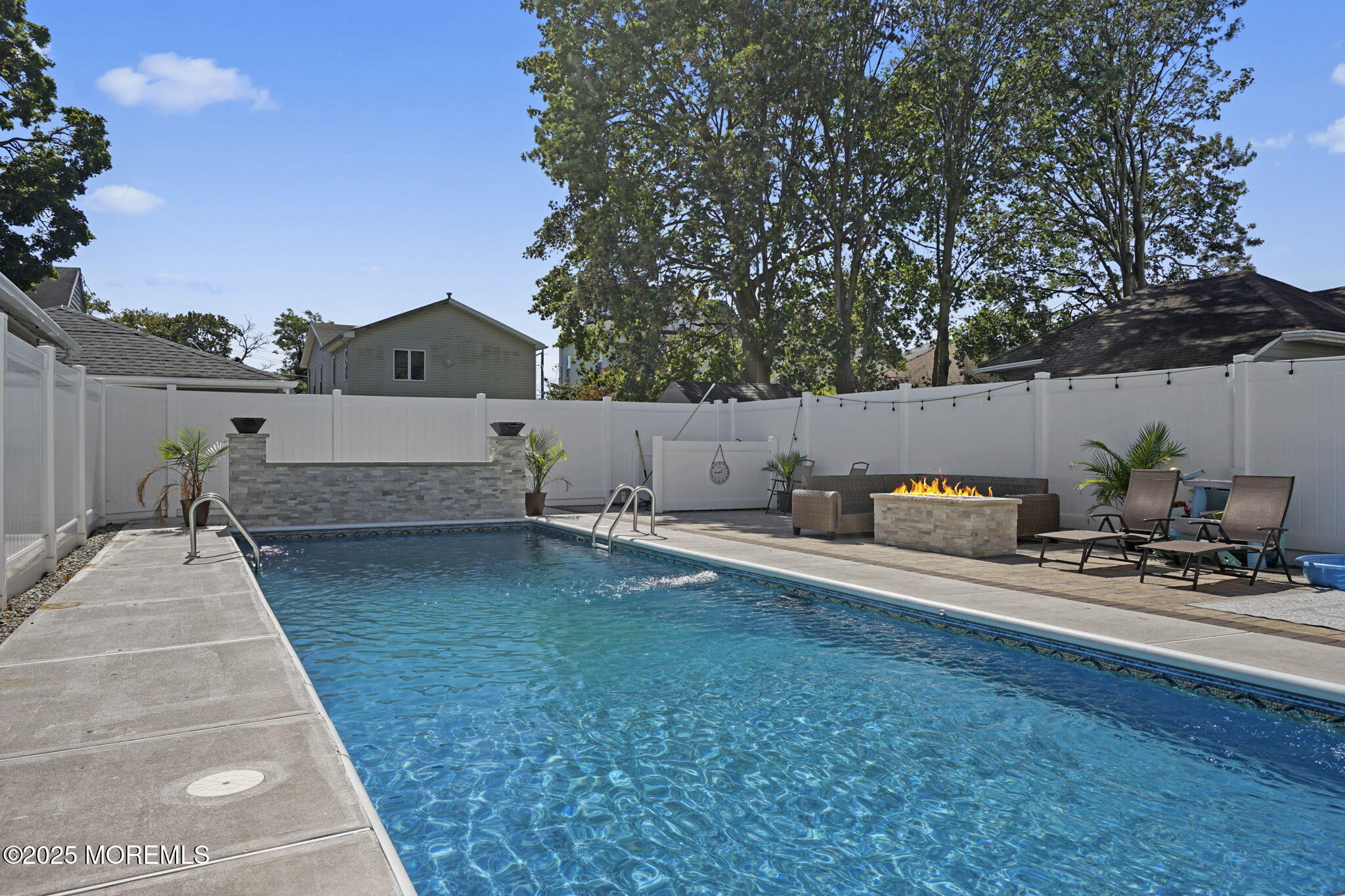 128 1st Street Keyport, NJ 07735 - Photo 36 of 38 a view of backyard with seating space and trees