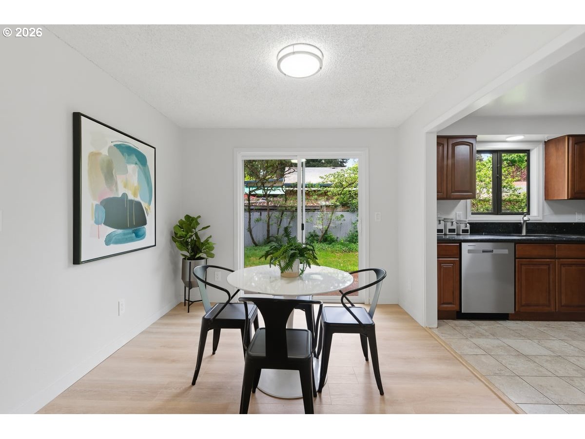 2137 Southeast 130th Avenue Portland, OR 97233 - Photo 4 of 14 a view of a dining room with furniture window and outside view