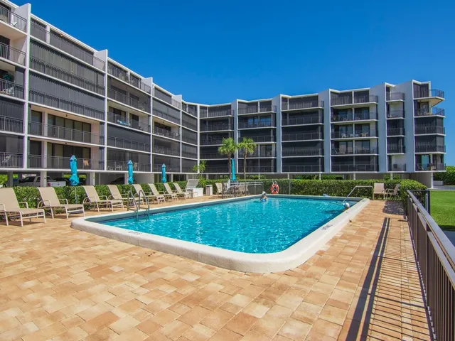 a view of swimming pool with a lounge chair