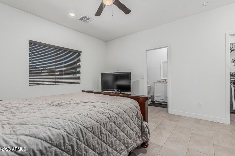 32102 North Walnut Street Wittmann, AZ 85361 - Photo 11 of 18 a bedroom with a bed and a television