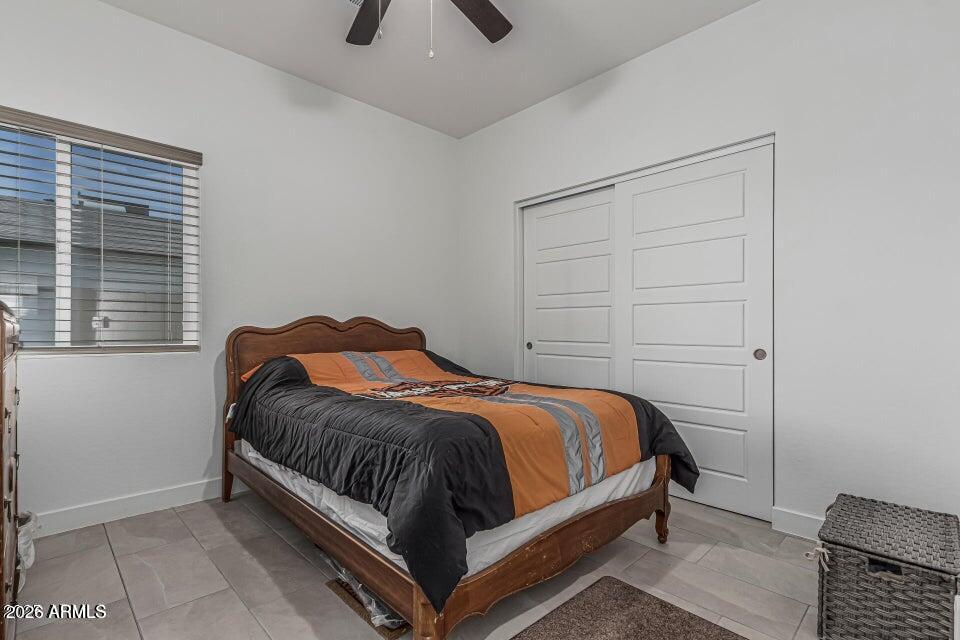 32102 North Walnut Street Wittmann, AZ 85361 - Photo 14 of 18 a bedroom with a bed and window
