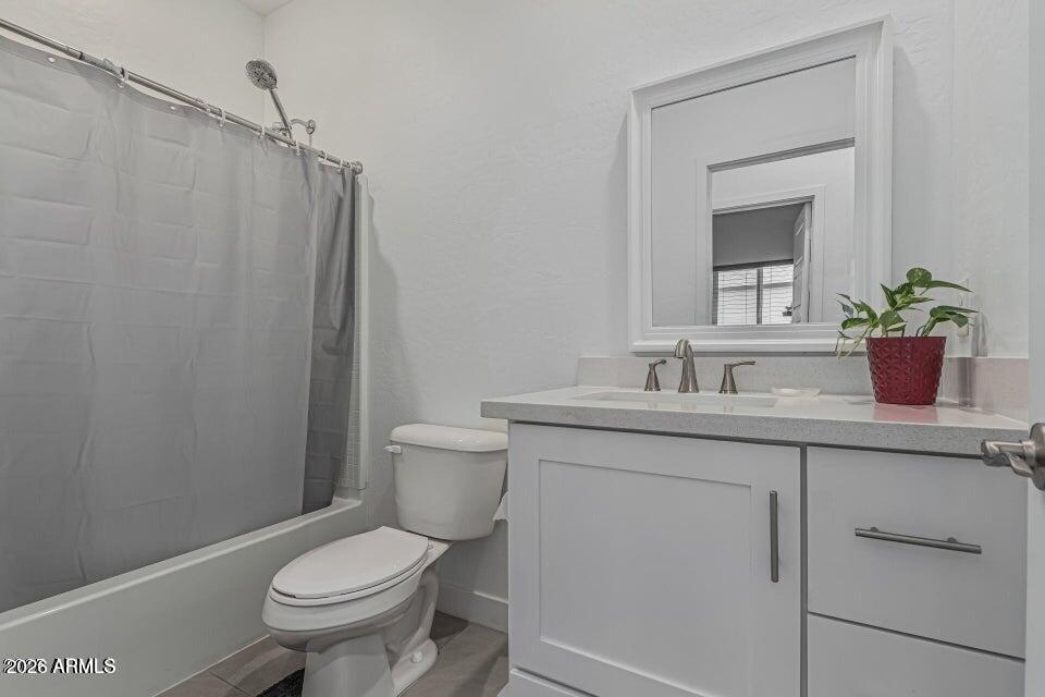 32102 North Walnut Street Wittmann, AZ 85361 - Photo 15 of 18 a bathroom with a toilet sink and mirror