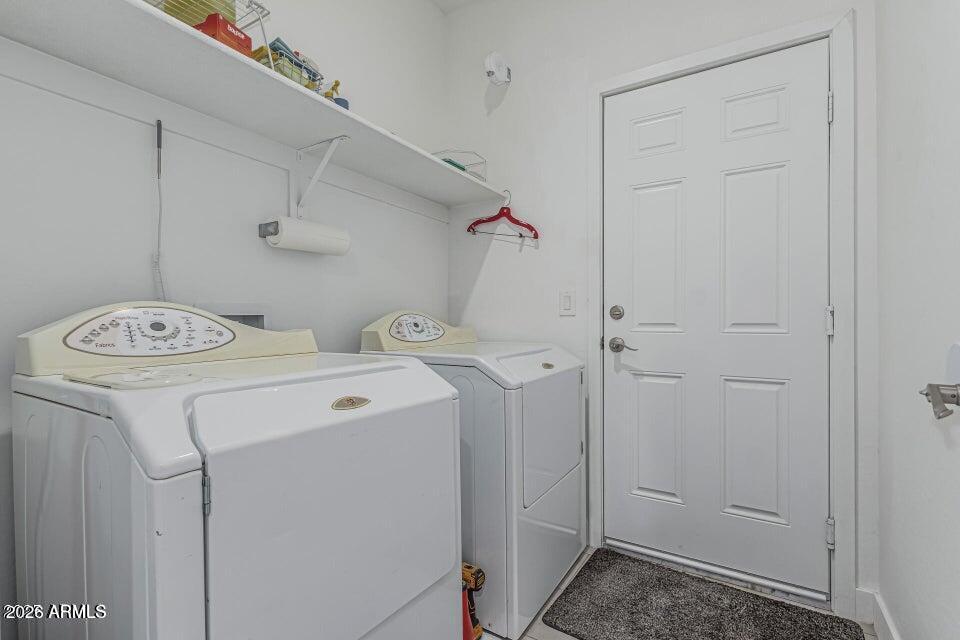 32102 North Walnut Street Wittmann, AZ 85361 - Photo 16 of 18 a utility room with dryer and washer