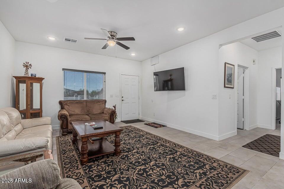 32102 North Walnut Street Wittmann, AZ 85361 - Photo 4 of 18 a living room with furniture and a rug