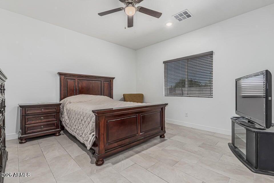 32102 North Walnut Street Wittmann, AZ 85361 - Photo 10 of 18 a bed room with a bed and a television