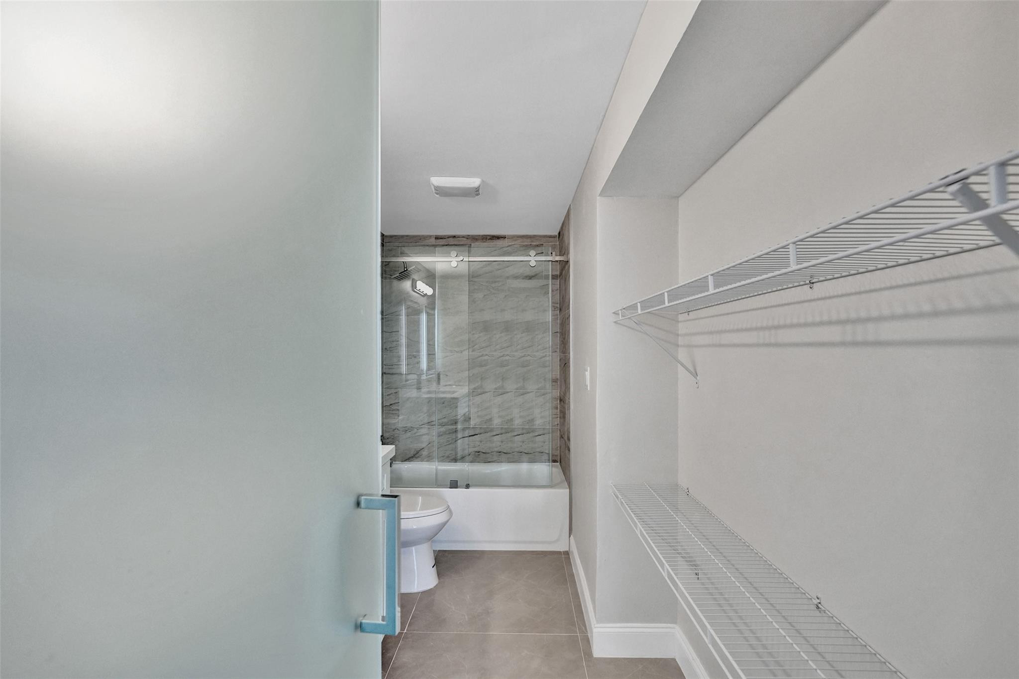4222 Inverrary Boulevard, Unit 4810 Lauderhill, FL 33319 - Photo 34 of 63 a bathroom with a bathtub and toilet