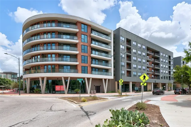 a view of a building with potted plants