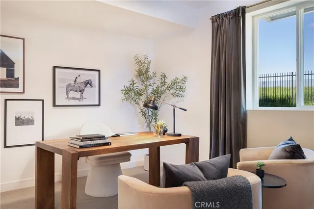 a view of a workspace with furniture