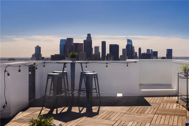 a view of a balcony with furniture