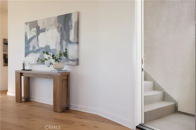 a living room with a bed furniture and a lamp