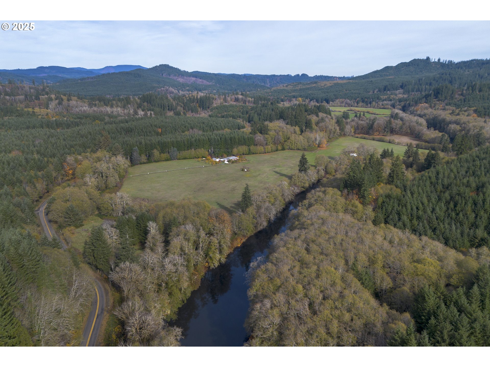 0 Highway 103 Seaside, OR 97138 - Photo 21 of 29 a view of a town with mountains in the background