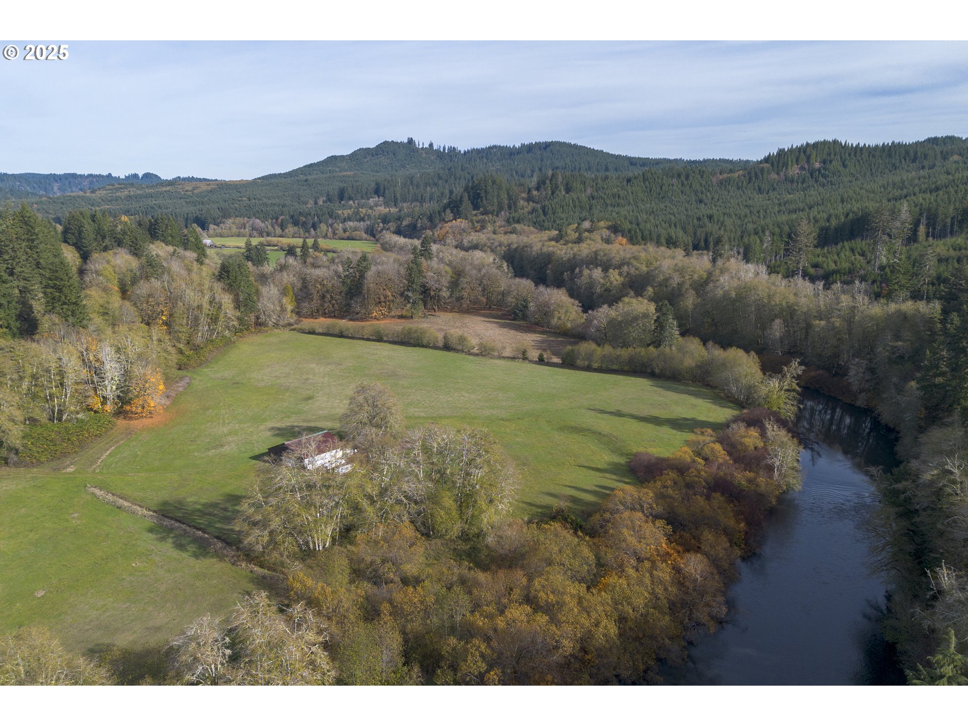 0 Highway 103 Seaside, OR 97138 - Photo 7 of 29 a view of a lush green hillside and a houses