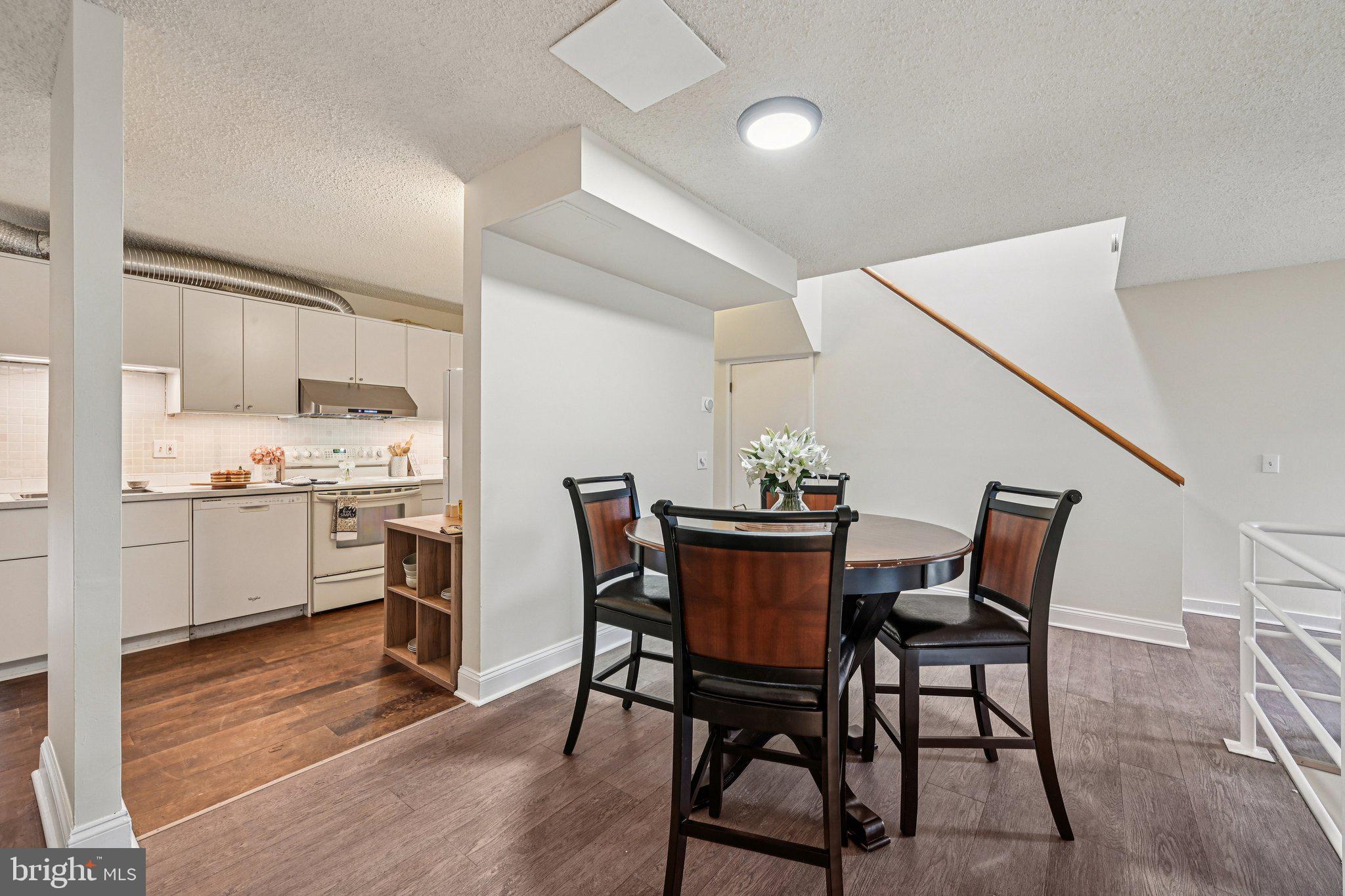 2303 Bayleaf Court Baltimore, MD 21209 - Photo 11 of 37 a view of a dining room with furniture and wooden floor