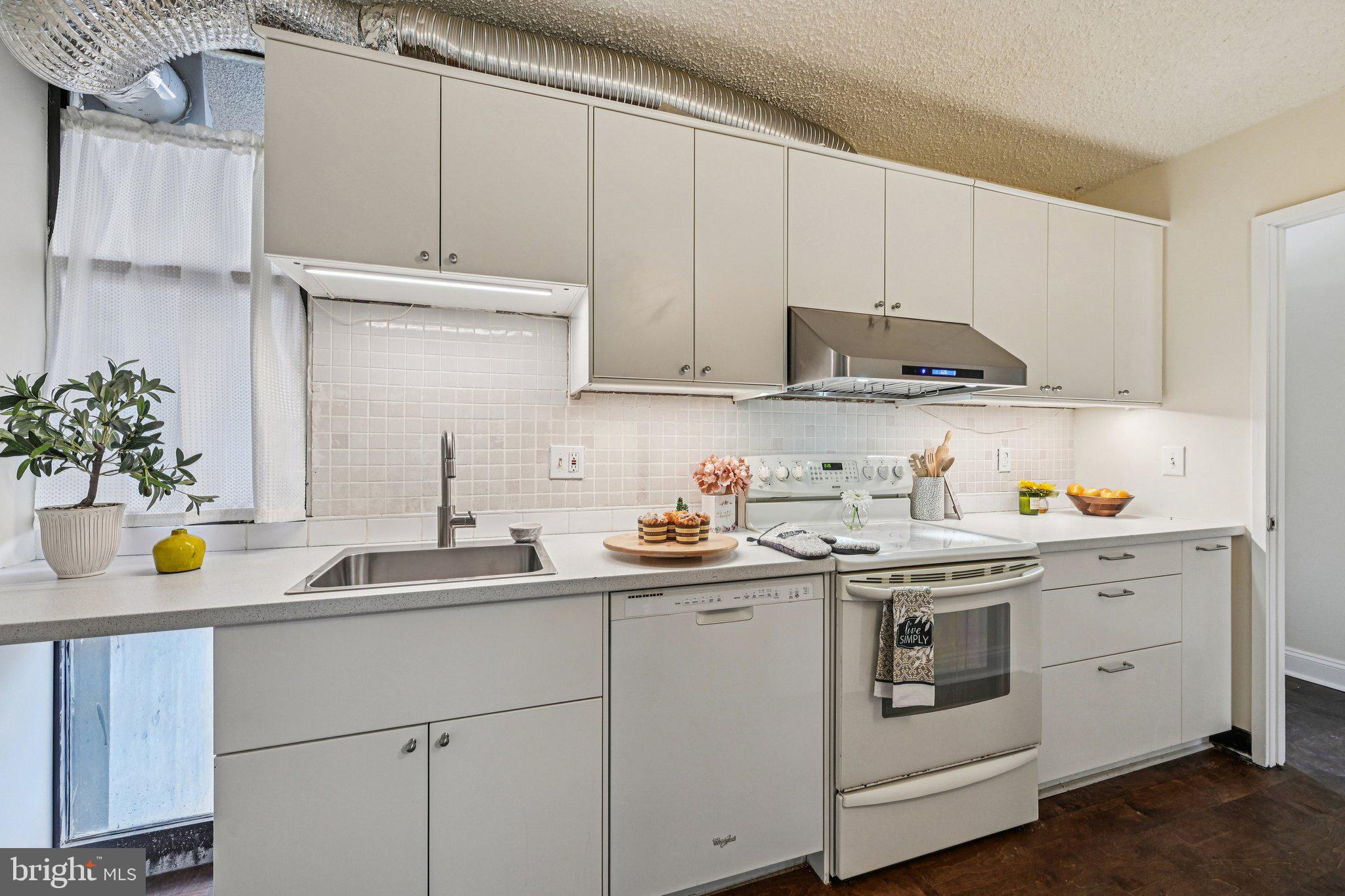 2303 Bayleaf Court Baltimore, MD 21209 - Photo 15 of 37 a view of a kitchen with a sink and cabinets