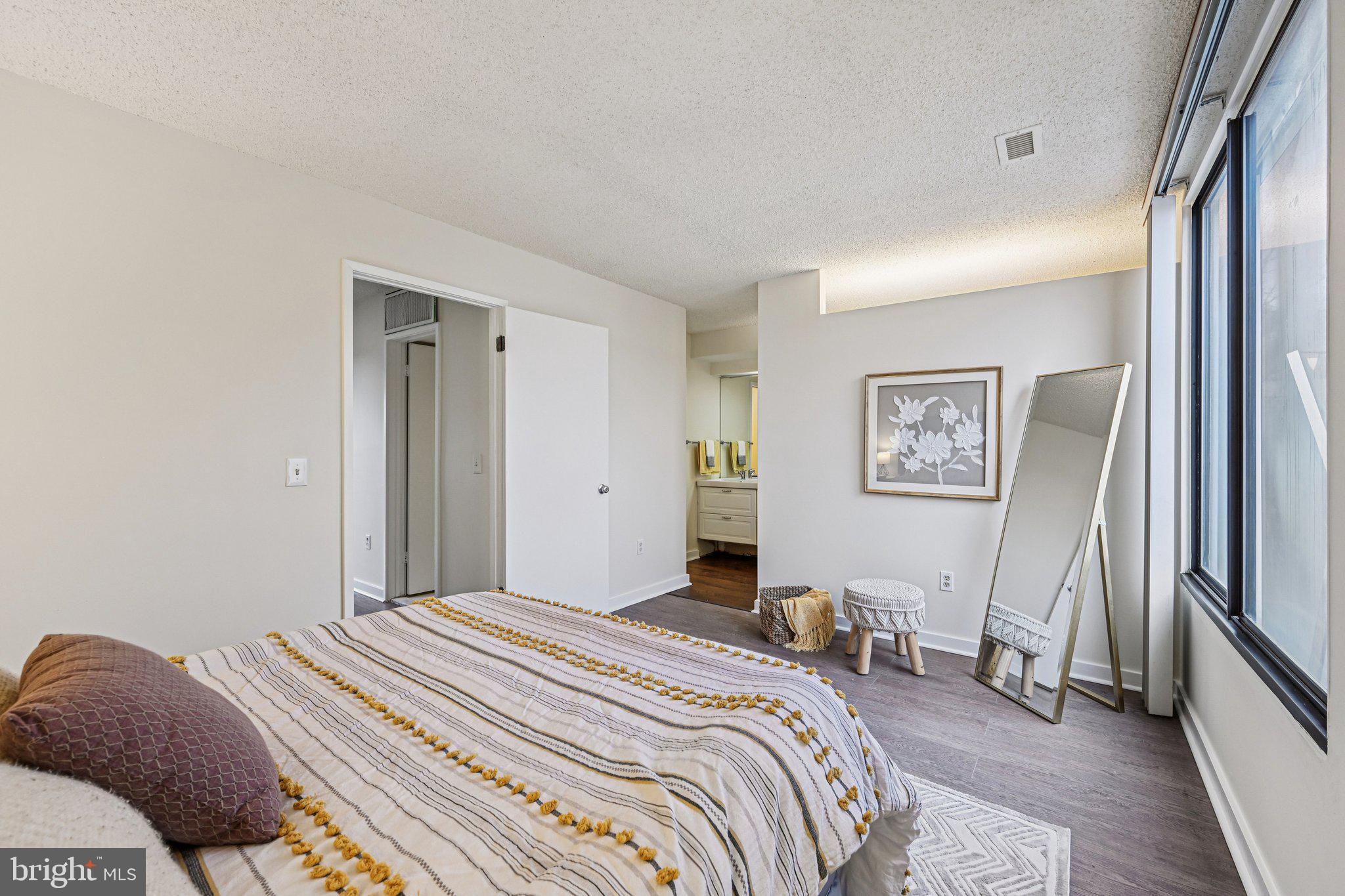 2303 Bayleaf Court Baltimore, MD 21209 - Photo 28 of 37 a bedroom with a large bed and a window