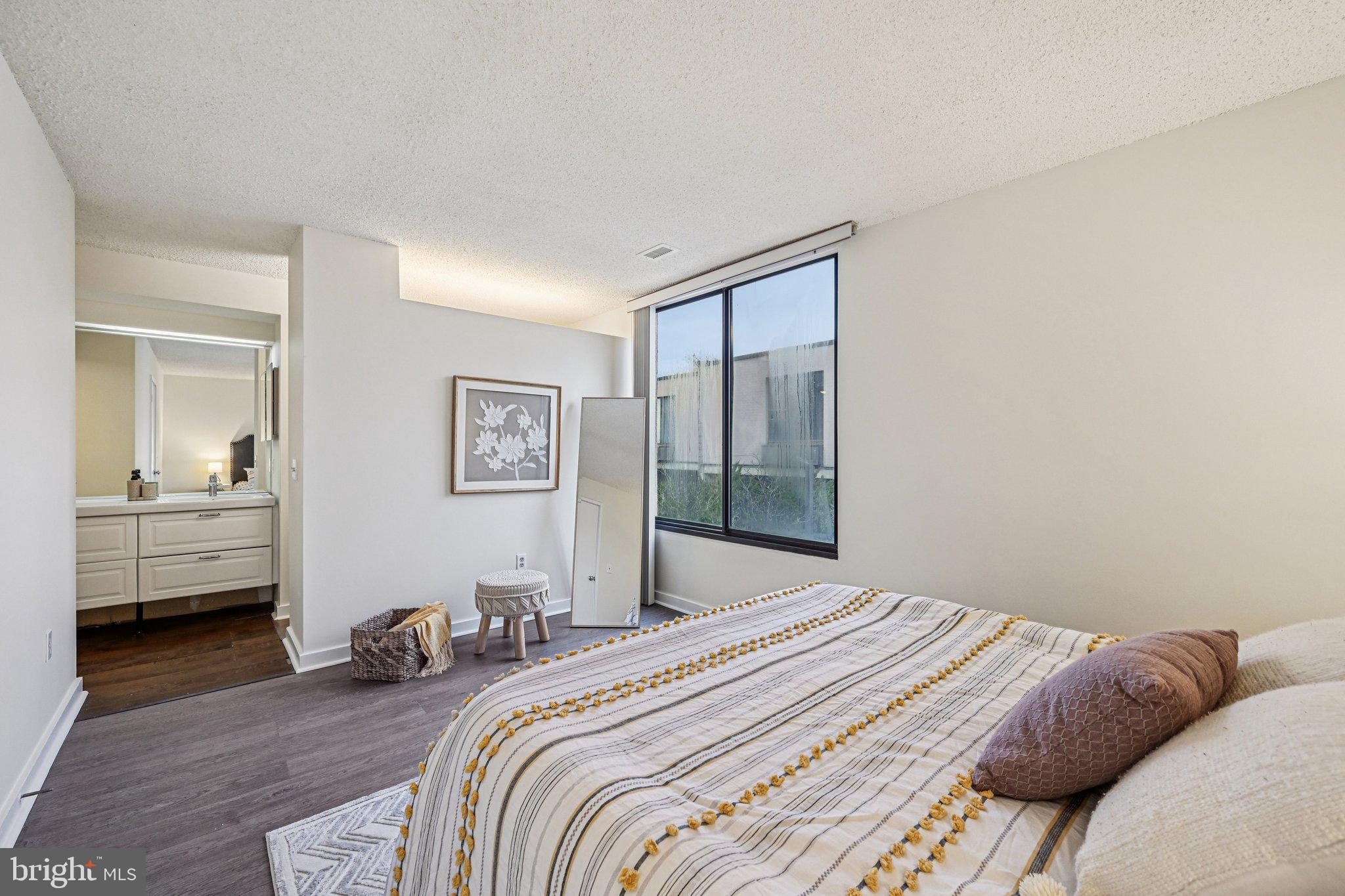 2303 Bayleaf Court Baltimore, MD 21209 - Photo 29 of 37 a bedroom with a bed and a view of bathroom