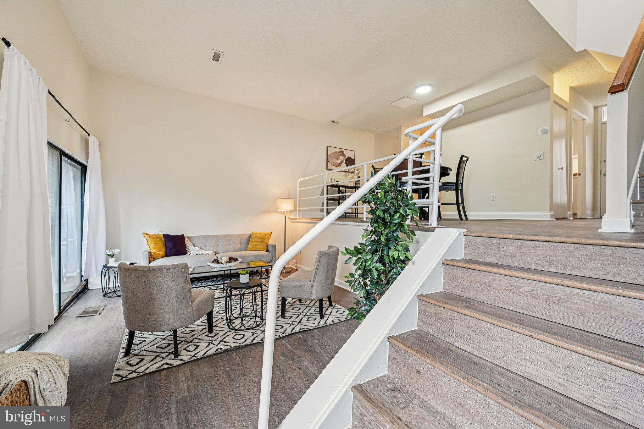 2303 Bayleaf Court Baltimore, MD 21209 - Photo 3 of 37 a living room with furniture and stairs