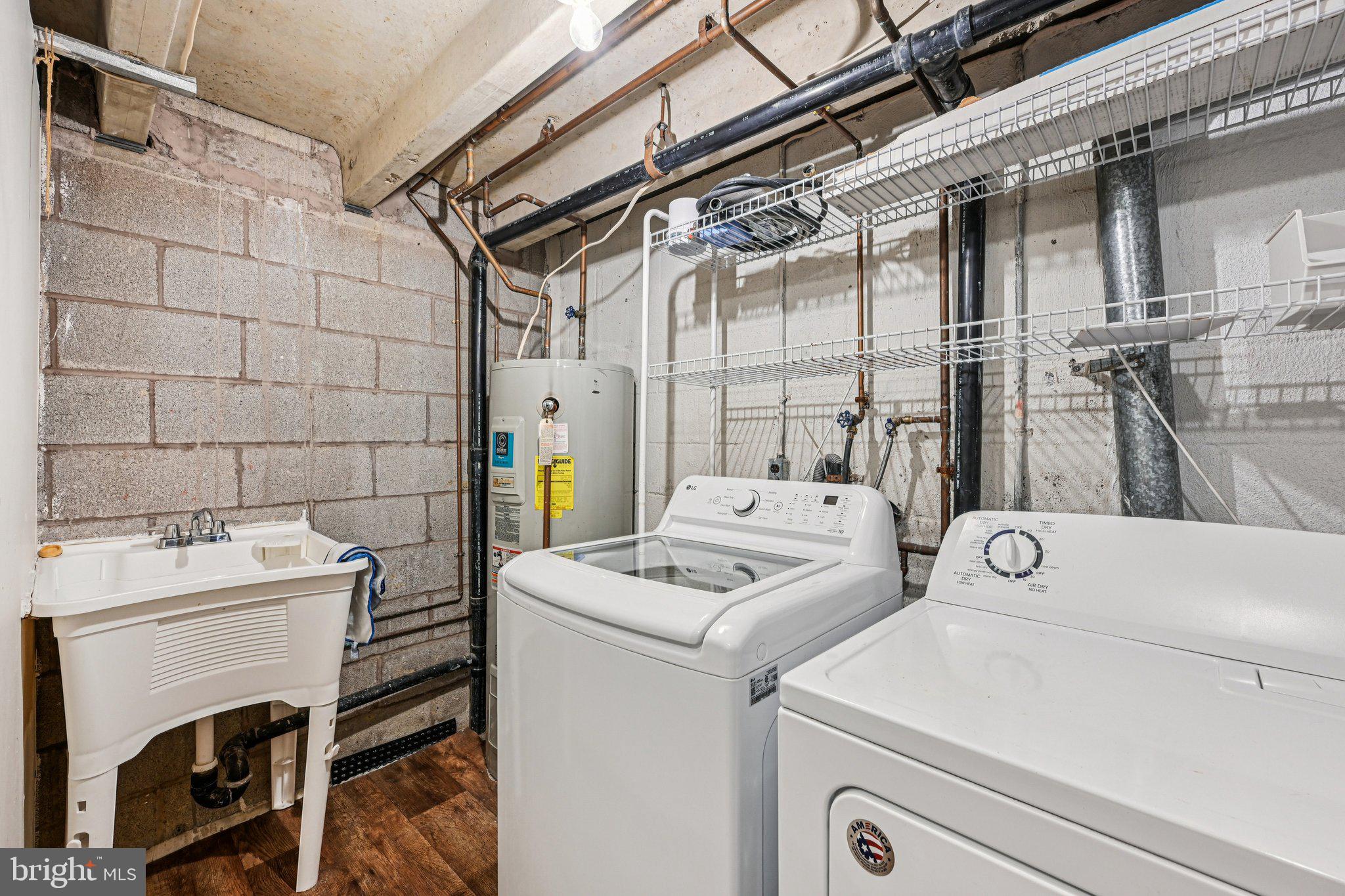 2303 Bayleaf Court Baltimore, MD 21209 - Photo 32 of 37 a utility room with dryer and washer