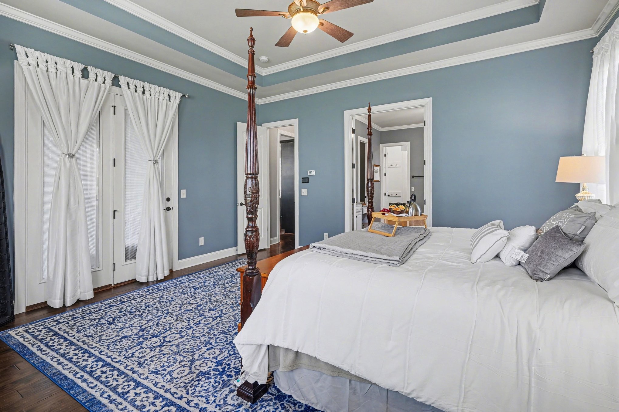 5094 Moss Road Nashville, TN 37221 - Photo 22 of 29 a bedroom with a bed and a chandelier
