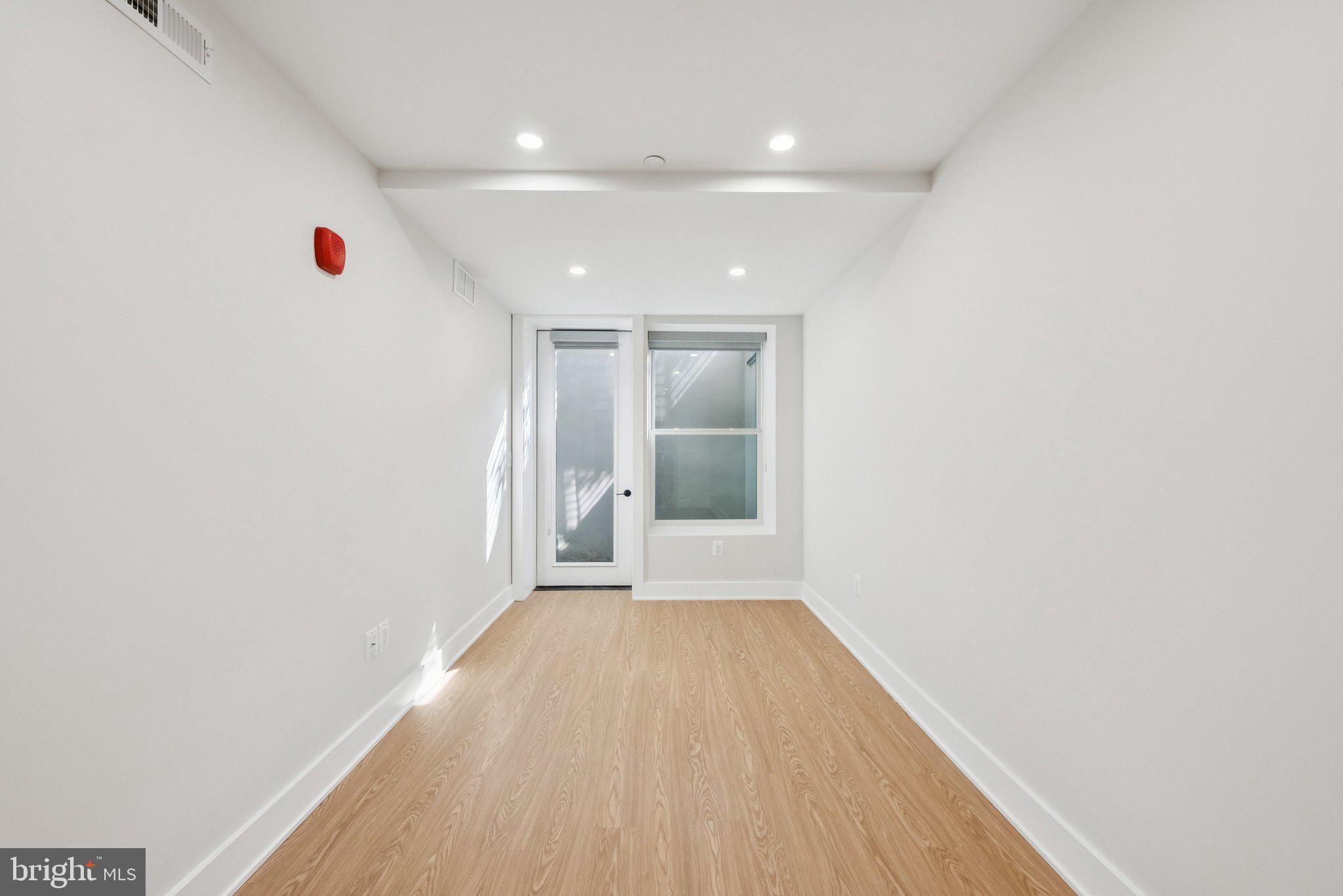 2134 Wisconsin Avenue Northwest, Unit 1 Washington, DC 20007 - Photo 12 of 32 a view of hallway with wooden floor