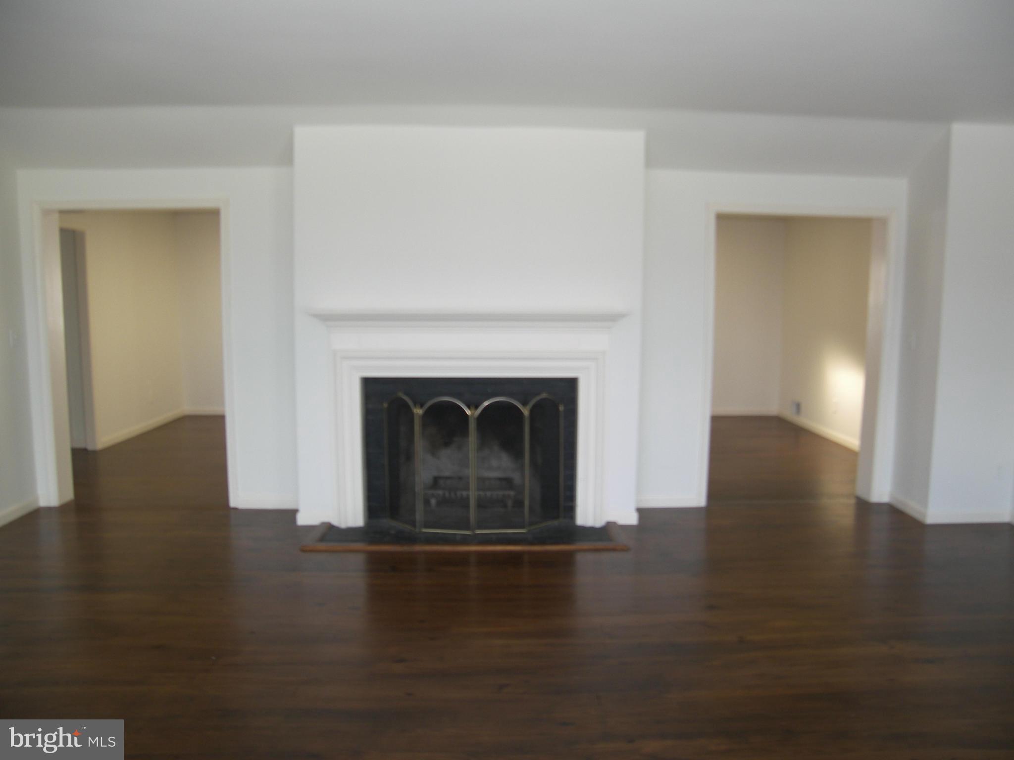 18458 Blue Ridge Mountain Road Bluemont, VA 20135 - Photo 4 of 30 a view of a livingroom with wooden floor a fireplace