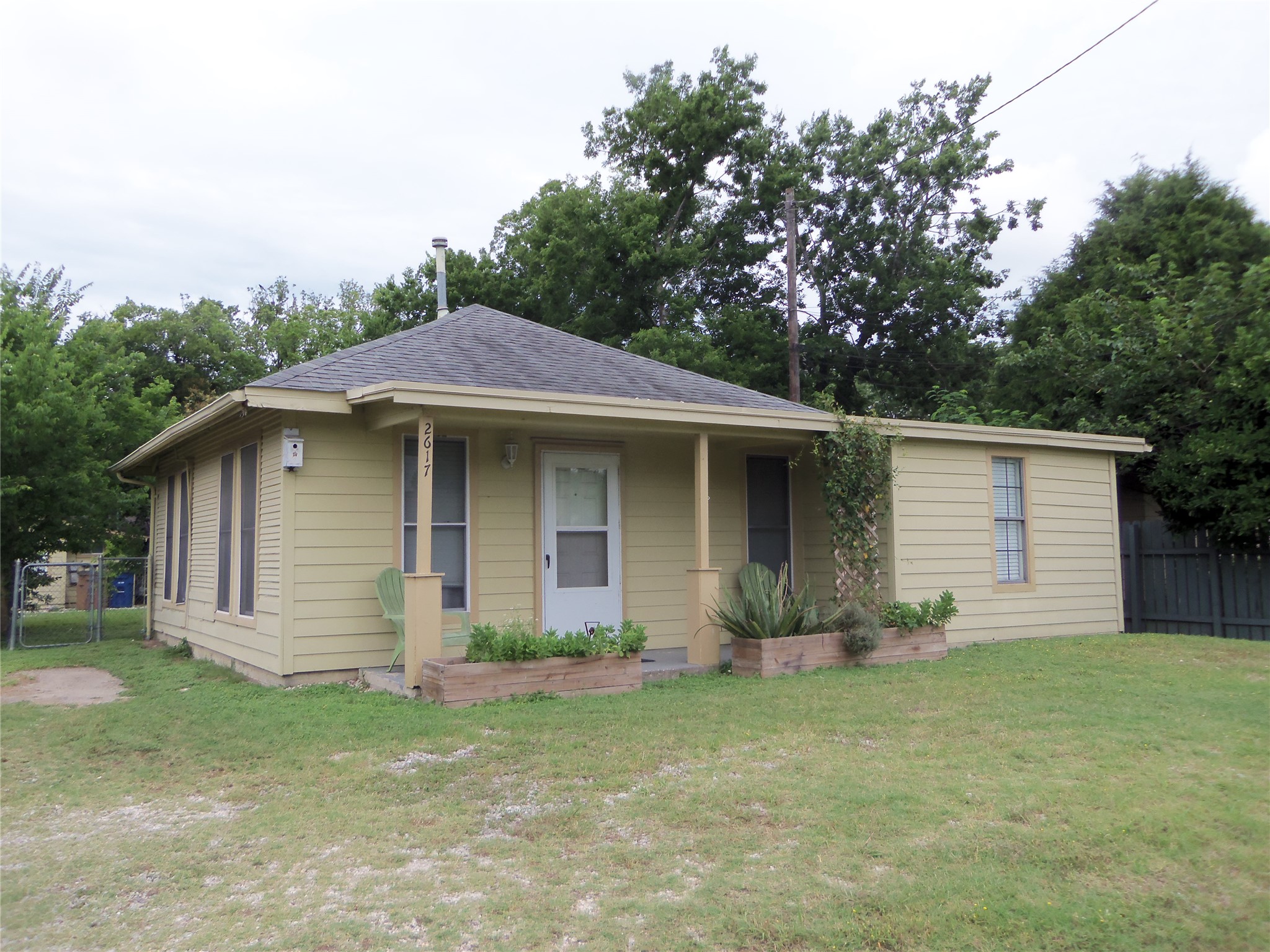 View of front of property with a shingled roof