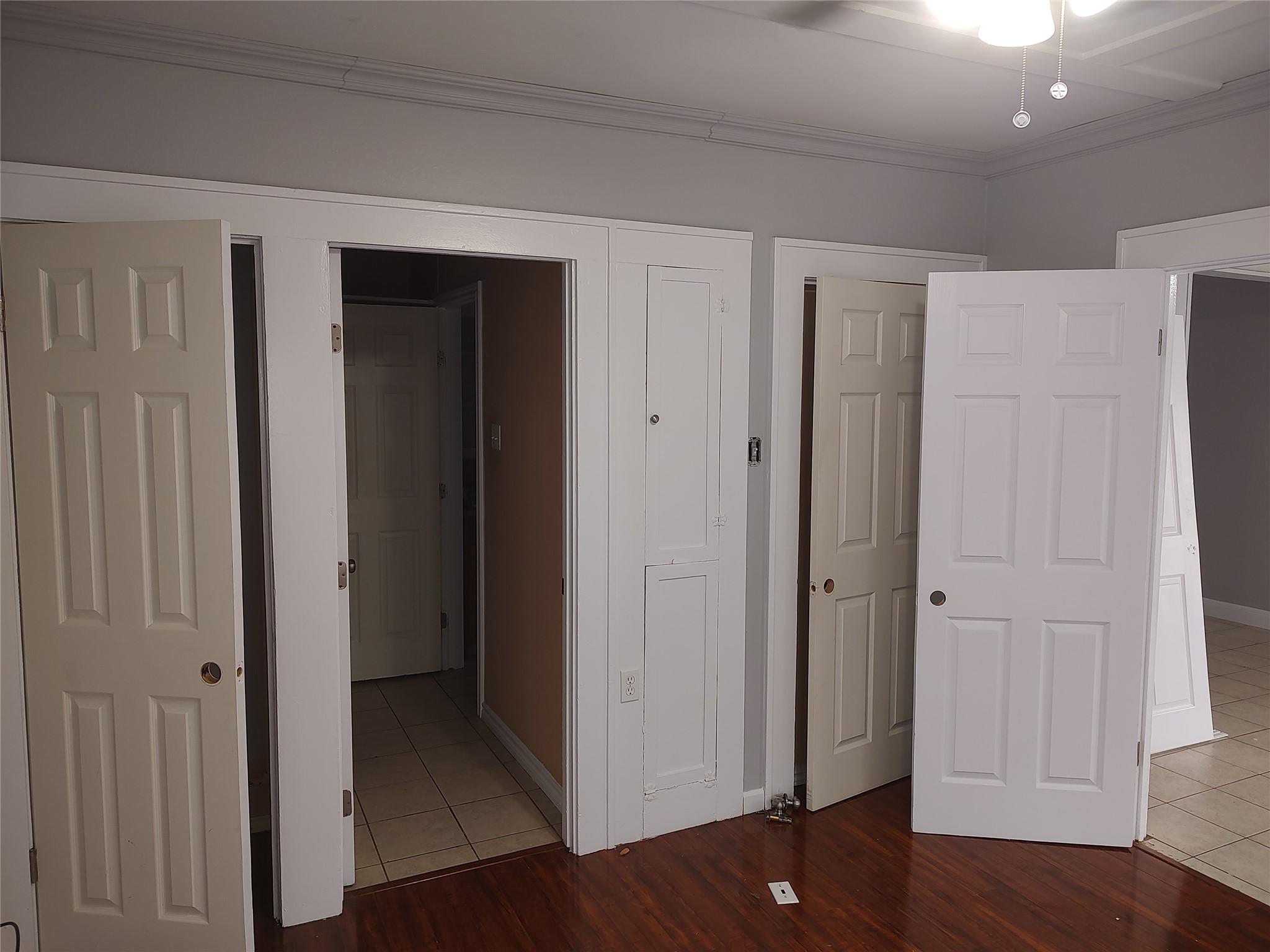2617 Wheless Lane Austin, TX 78723 - Photo 8 of 14 Unfurnished bedroom featuring light tile patterned flooring and crown molding