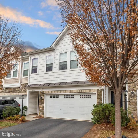a front view of a house with a garage