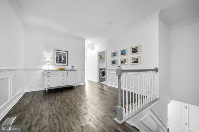 a bedroom with a large bed and windows