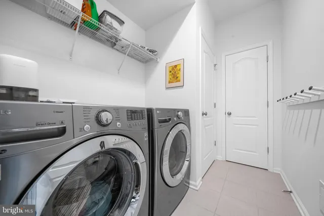 a spacious bedroom with a bed window and a table