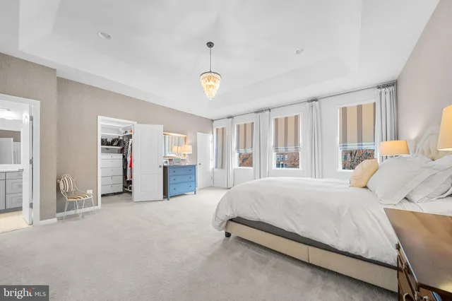 a bathroom with a sink shower and a mirror