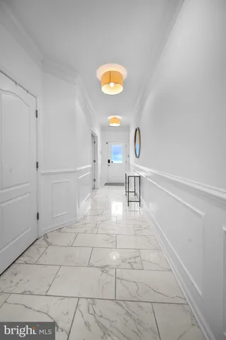 a kitchen with stainless steel appliances granite countertop a sink a stove and a wooden floors