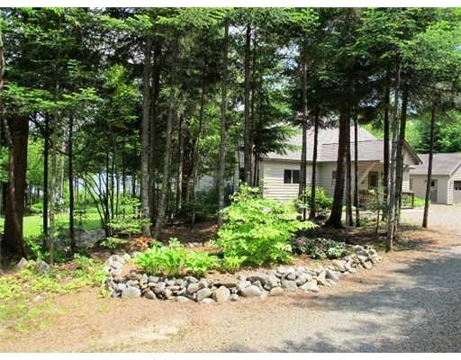 94 Pleasant Island Road Oquossoc, ME 04964 - Photo 23 of 28 Exterior Front. Guest Bedroom In...