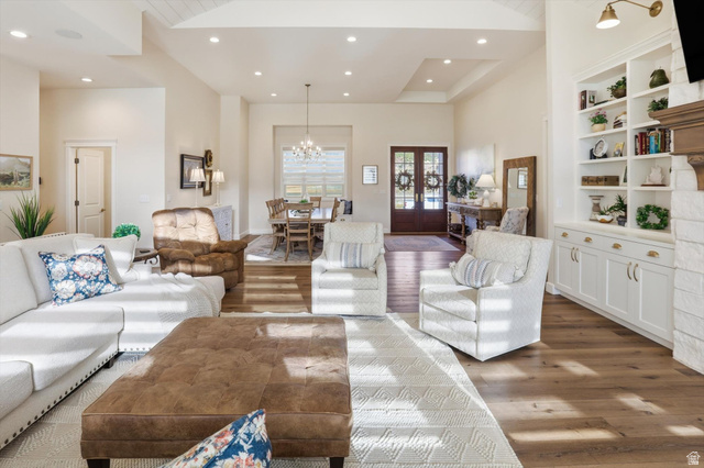 534 East Fish Hatchery Road Mantua, UT 84324 - Photo 4 of 87 Living room featuring hanging lights, wood finished floors, built in shelves, and french doors