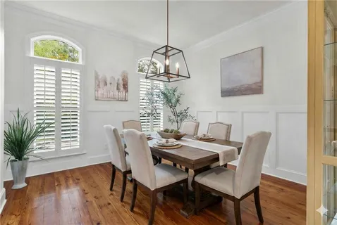 a spacious bathroom with a granite countertop sink a mirror and a shower