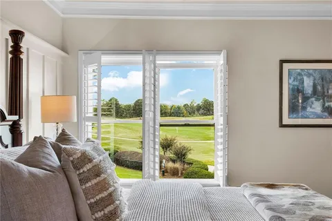 a view of a workspace with furniture and wooden floor