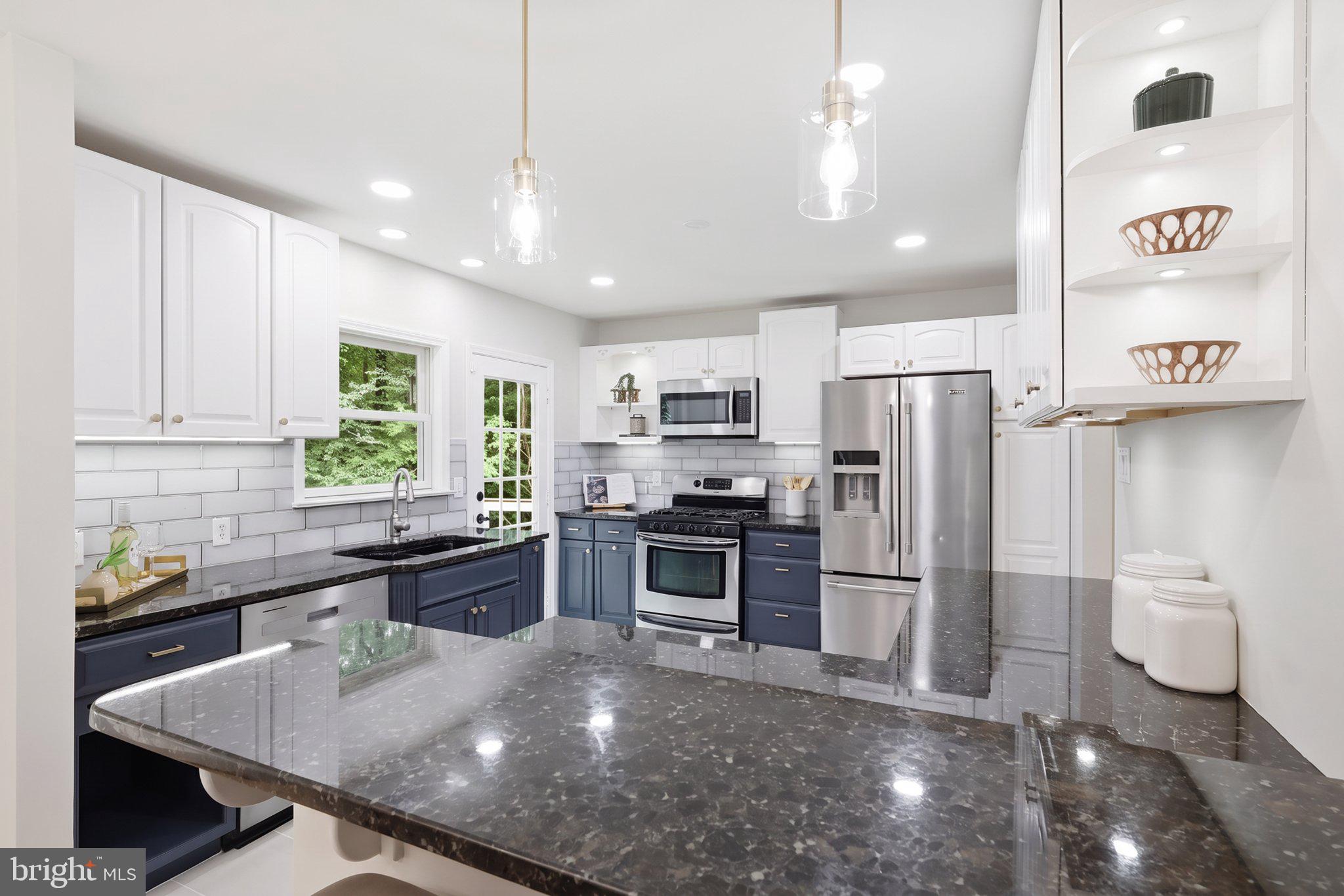 7113 Hadlow Court Springfield, VA 22152 - Photo 9 of 37 Kitchen with new pendant and recessed lights