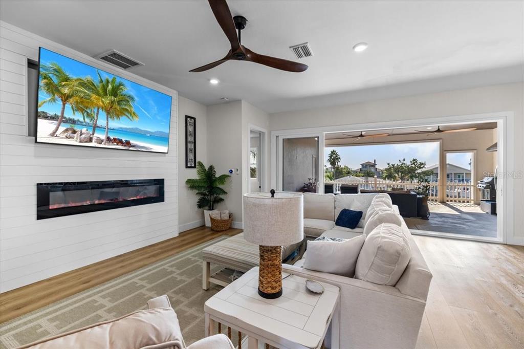 3344 Gulfview Drive Hernando Beach, FL 34607 - Photo 13 of 70 a living room with furniture and a fireplace