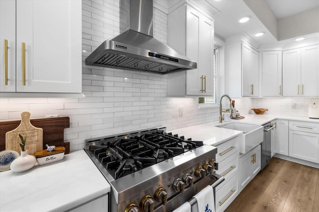 3344 Gulfview Drive Hernando Beach, FL 34607 - Photo 18 of 70 a kitchen with a stove and a sink