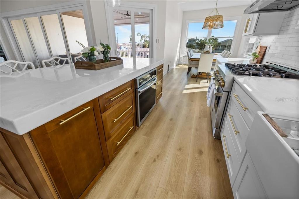3344 Gulfview Drive Hernando Beach, FL 34607 - Photo 20 of 70 a kitchen with granite countertop lots of counter top space and wooden floor