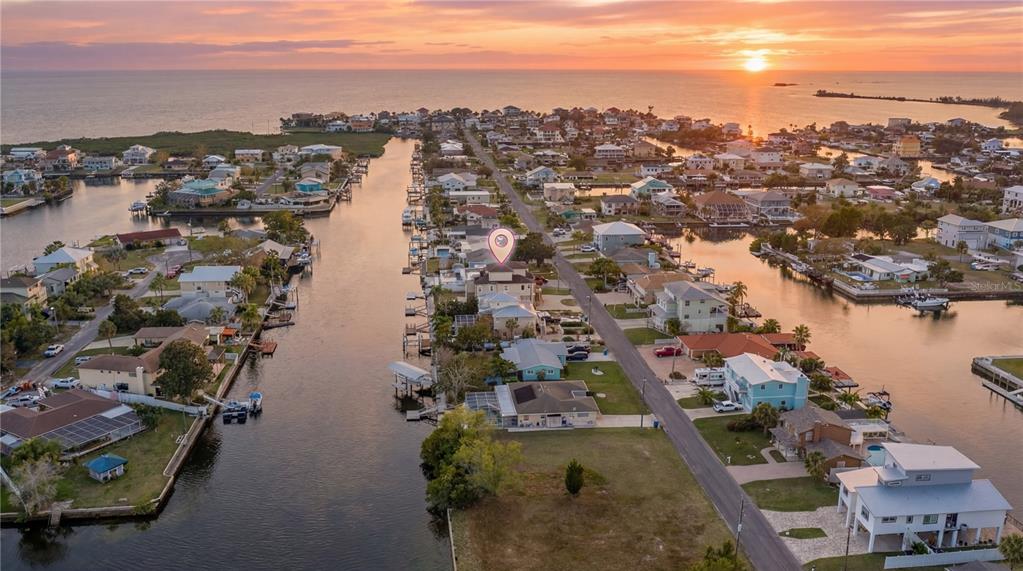 3344 Gulfview Drive Hernando Beach, FL 34607 - Photo 2 of 70 an aerial view of city and lake with trees all around