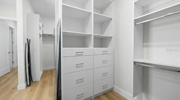 a view of a room that has a table and chairs in it