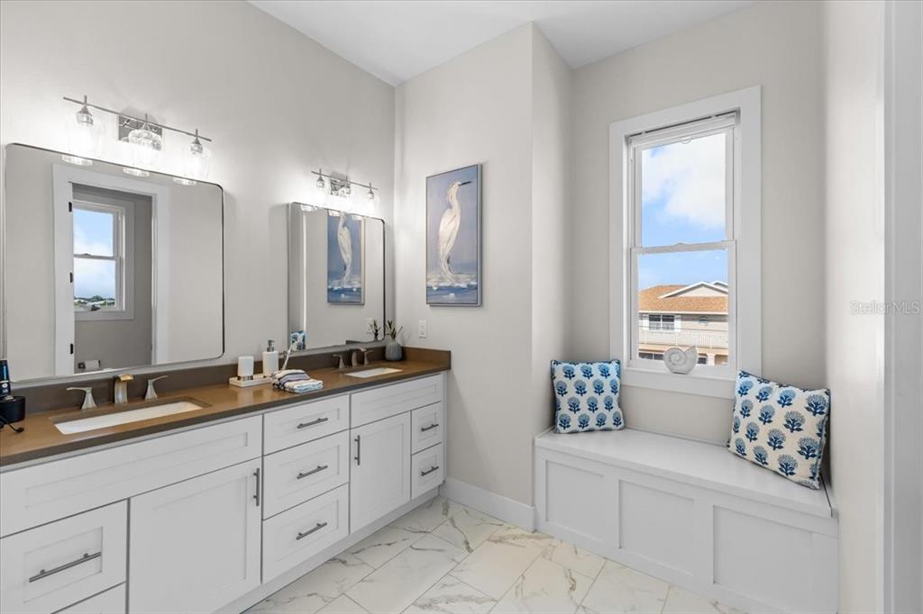 3344 Gulfview Drive Hernando Beach, FL 34607 - Photo 32 of 70 a spacious en suite bathroom with double sink and a mirror